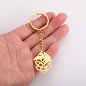 Polished gold horse head keychain featuring a traditional Celtic knot cutout design