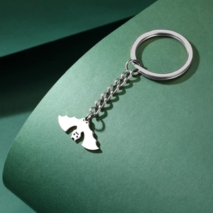 Polished stainless steel bat pendant keychain with silver metallic luster detail