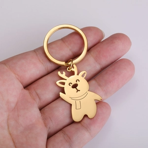 Detailed view of the gold-plated metal reindeer keychain with cute reindeer pendant
