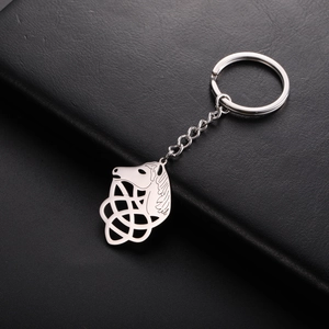 Polished stainless steel horse head keychain with Celtic knot on a black leather background
