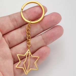 Close-up of a gold stainless steel keychain with Star of David and map outline pendant