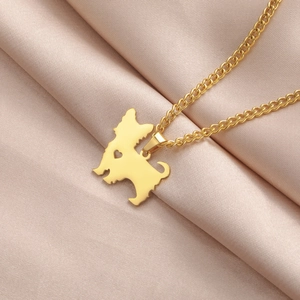 Polished gold stainless steel Yorkshire Terrier dog pendant necklace with heart cut-out