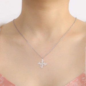 Minimalist stainless steel necklace featuring a geometric windmill pendant on a silver chain