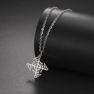 Detailed view of stainless steel windmill pendant with Viking symbol on black stand