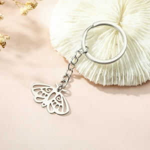 Porte-clés en acier inoxydable avec pendentif papillon évidé et chaîne à maillons