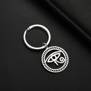 Close-up of Eye of Horus stainless steel keychain with silver hollowed metal details