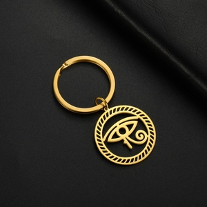 Macro detail of golden Eye of Horus pendant on premium black leather background