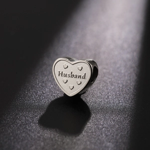 Polished silver heart charm with Husband engraving and small decorative hearts