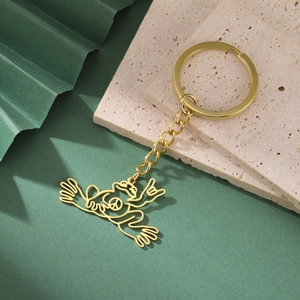 Golden stainless steel frog keychain with peace sign pendant and high polish finish