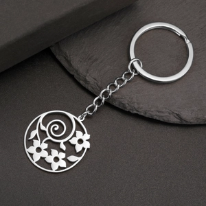 Polished stainless steel keychain with intricate hollow flower pendant and silver chain