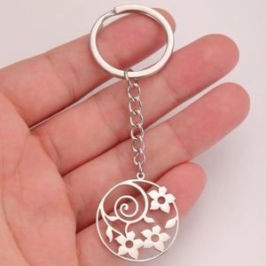 Modern silver stainless steel keychain featuring a hollow flower pendant and secure metal chain