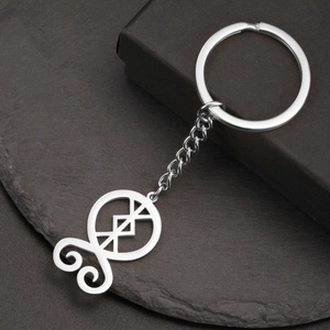 Polished stainless steel keychain featuring a geometric troll cross pendant on black stone
