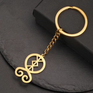 Detailed macro view of the gold-plated stainless steel keychain with a Norse rune pendant