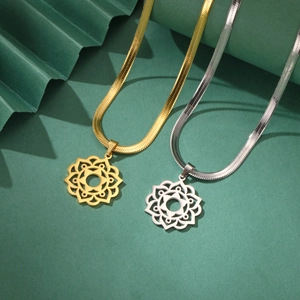 Detailed view of gold and silver snake chain necklaces with hollow mandala pendants