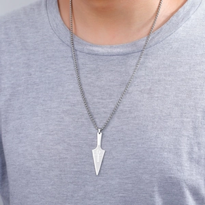 Silver stainless steel Ankh arrow pendant necklace worn by male model on a grey shirt