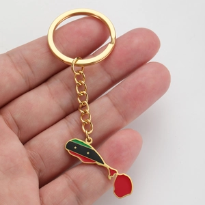 Detailed view of Saint Kitts and Nevis map keychain featuring vibrant flag colors and stars
