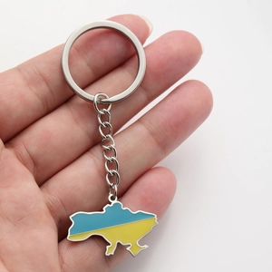 Detail of the blue and yellow enamel Ukraine map keychain on a polished metal ring