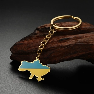 Detail of Ukraine map keychain with blue and yellow enamel on golden stainless steel