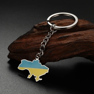 Detail of Ukraine map keychain with blue and yellow enamel on silver stainless steel