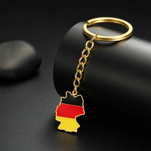 Detailed close-up of a gold Germany map keychain with black, red, and gold flag colors