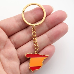 Detail of gold stainless steel Spain map keychain with red and orange enamel finish