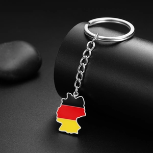 Detailed macro view of Germany map keychain with tricolor enamel on a black stand