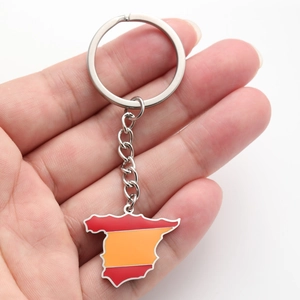 Detail of stainless steel keychain with Spain map pendant in national flag colors