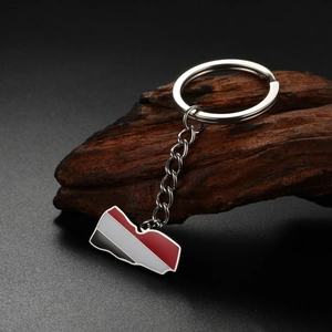 Macro shot of Yemen map keychain with red white and black enamel on polished steel