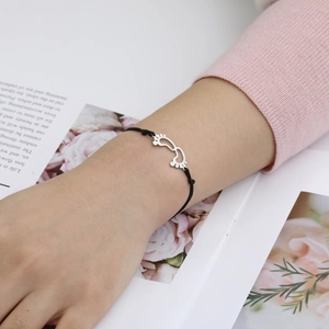 Adjustable black rope bracelet with stainless steel baby footprint charms for women