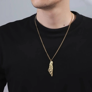 Close-up of gold plated Israel map pendant with Arabic calligraphy on curb chain