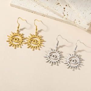 Detail of 304 stainless steel celestial sun eye dangle earrings in gold and silver finish
