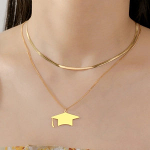 Double-layered gold graduation necklace with a polished doctoral cap pendant in titanium steel