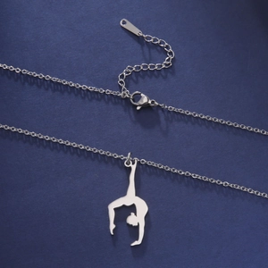 Detailed view of silver stainless steel rhythmic gymnast silhouette pendant and clasp