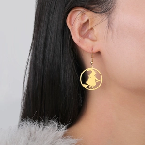 Gold stainless steel hoop earrings featuring a silhouette of a witch riding a broomstick