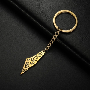 Macro detail of Israel map keychain with engraved floral patterns and black enamel finish