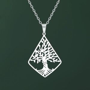 Detailed view of hollow tree of life pendant on stainless steel triangle necklace