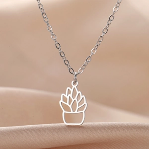 Succulent cactus pendant necklace in polished stainless steel on silk background