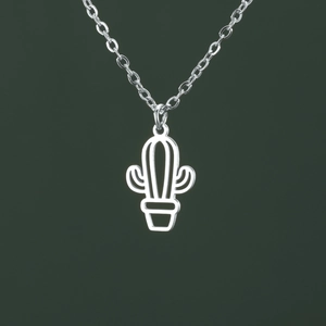 Detail of minimalist hollow cactus pendant on silver O-chain against green backdrop