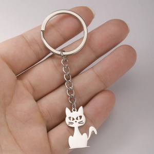 Minimalist silver stainless steel keychain featuring a cute hollow-out cat charm pendant