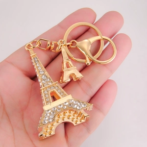Golden Eiffel Tower keychain with sparkling white rhinestones and a lobster clasp
