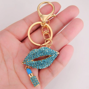 Porte-clés chic lèvres en strass bleus avec pendentif rouge à lèvres et fermoir doré