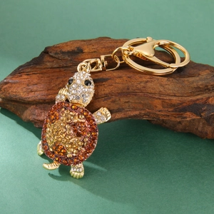 Sparkling rhinestone sea turtle keychain in gold alloy with crystal bag accessory