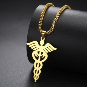 Macro shot of gold-plated stainless steel Caduceus pendant on a sleek box chain necklace