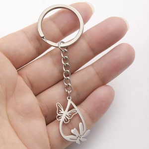 Handheld silver hollow butterfly flower pendant keychain in stainless steel teardrop shape
