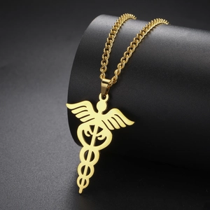 Close-up of golden Caduceus medical pendant with wings and snakes in polished finish
