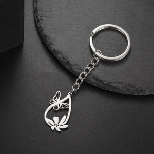 Detailed view of stainless steel keychain with hollow butterfly and flower pendant design