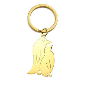 Polished gold stainless steel keychain featuring a minimalist penguin family pendant charm