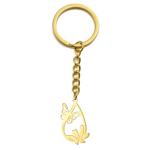 Golden hollow butterfly and flower pendant stainless steel keychain on white background