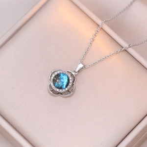Rotating planet necklace with blue galaxy stone and zircon pendant in a silk gift box