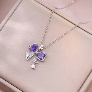 Silver titanium steel necklace with purple heart-shaped bow pendant and zircon detail